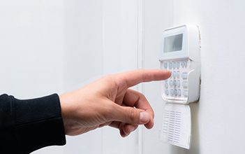 Hand Entering Alarm System Password of an Apartment — Locksmith in Lithgow, NSW